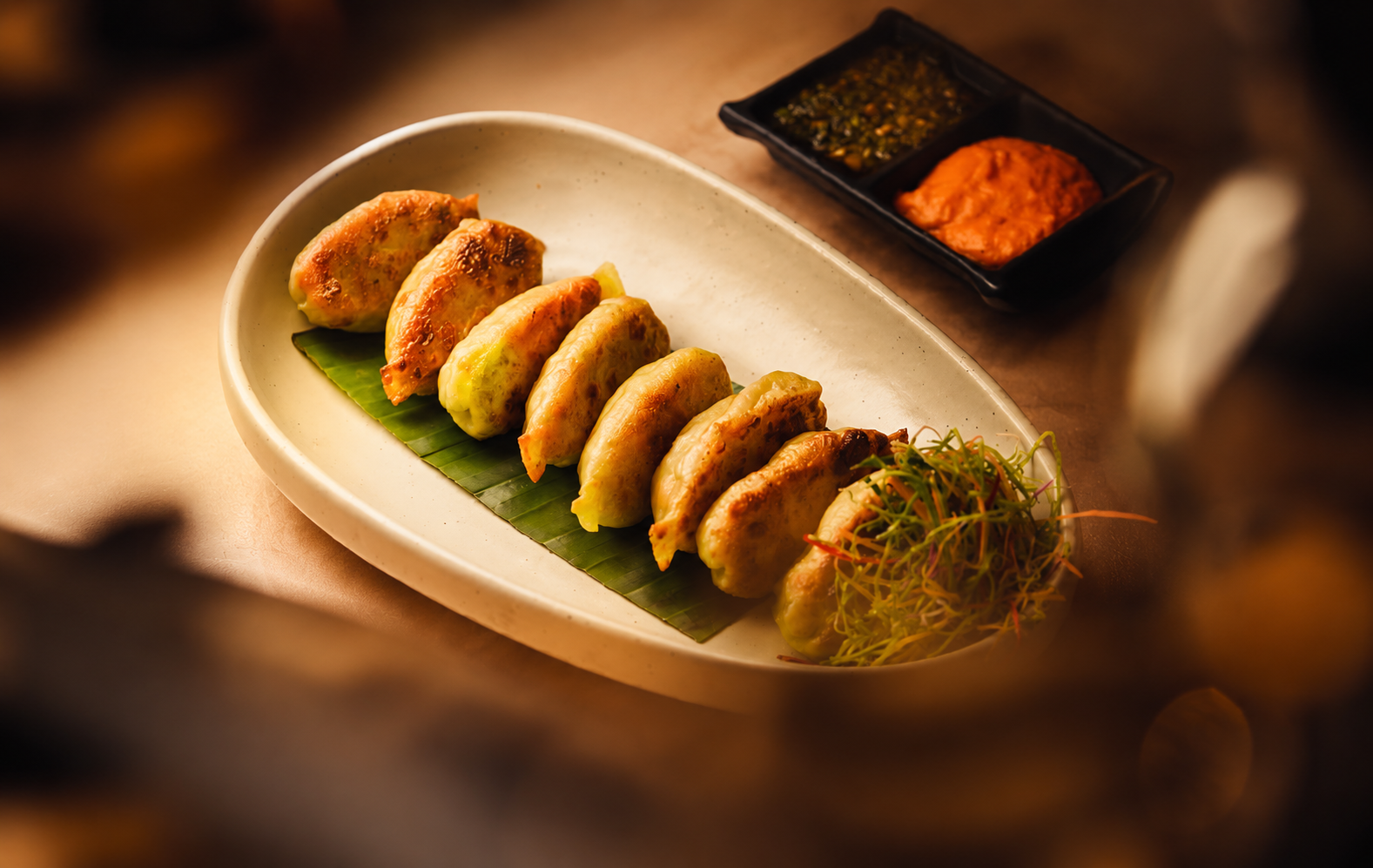 Pan-seared dumplings with dipping sauces